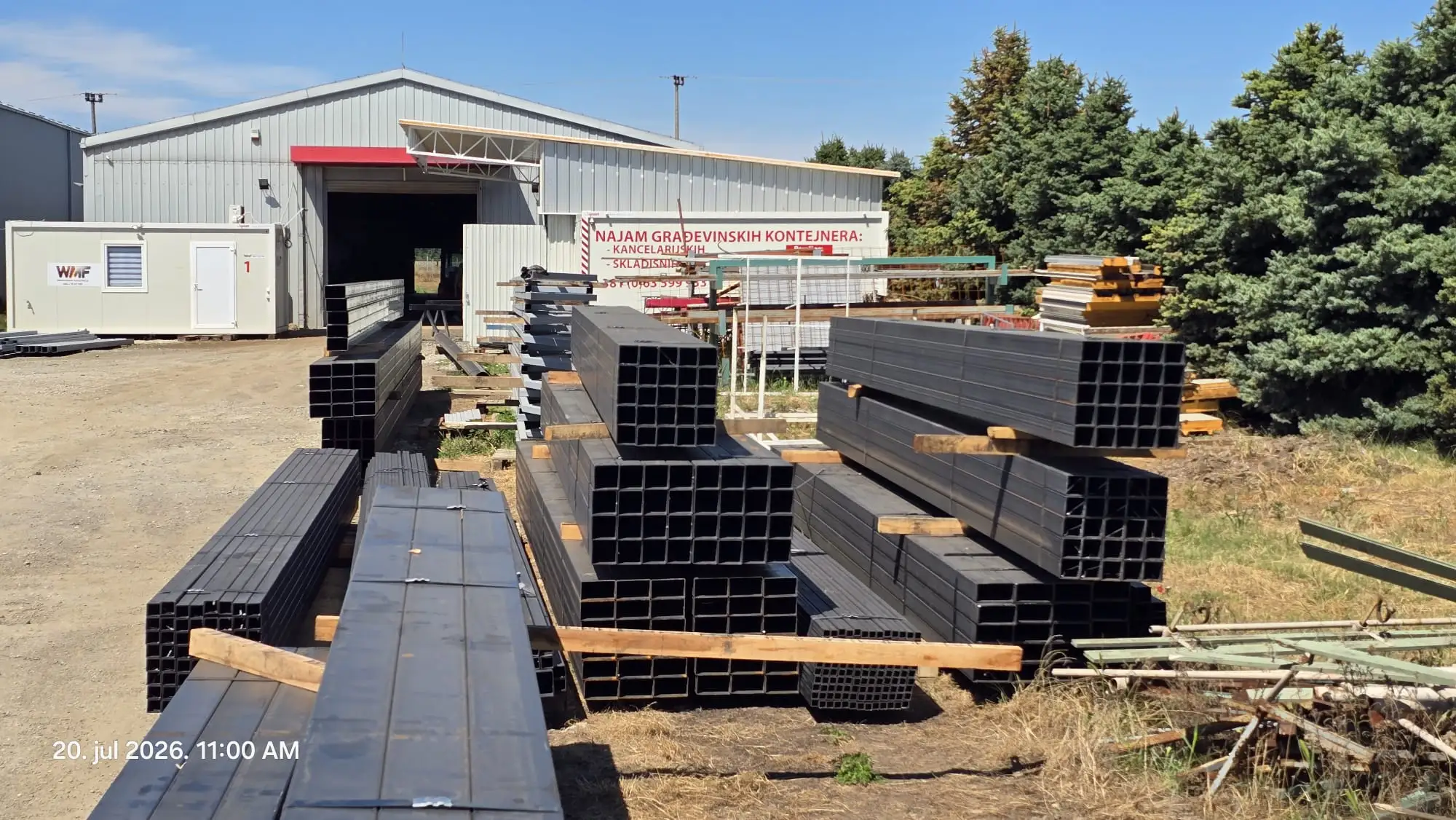 Square steel tube stock stacked at the workshop yard