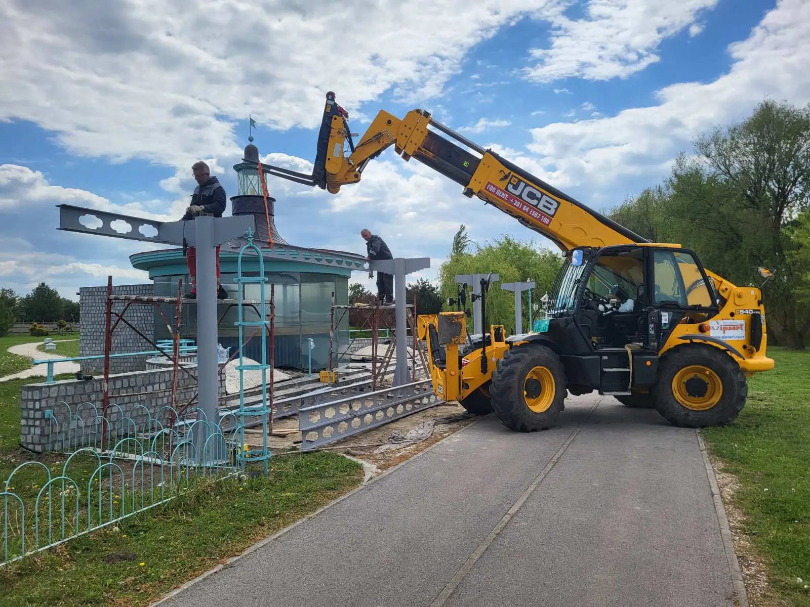 Steel roof beams being installed on a park pavilion