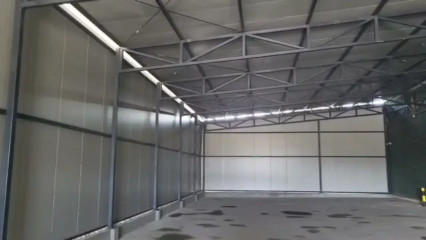 Warehouse interior with steel roof trusses